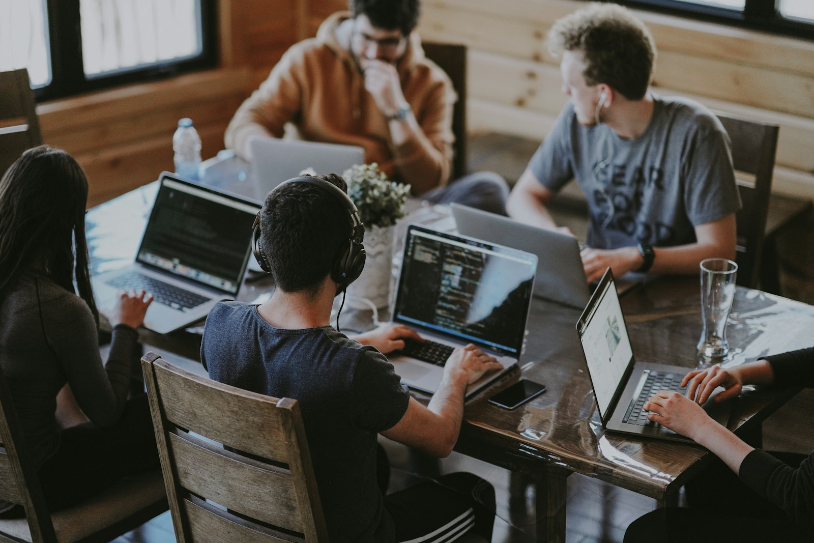 Development team members collaborating around a table